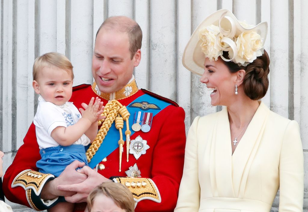 Prince Louis clapping on palace balcony with William and Kate