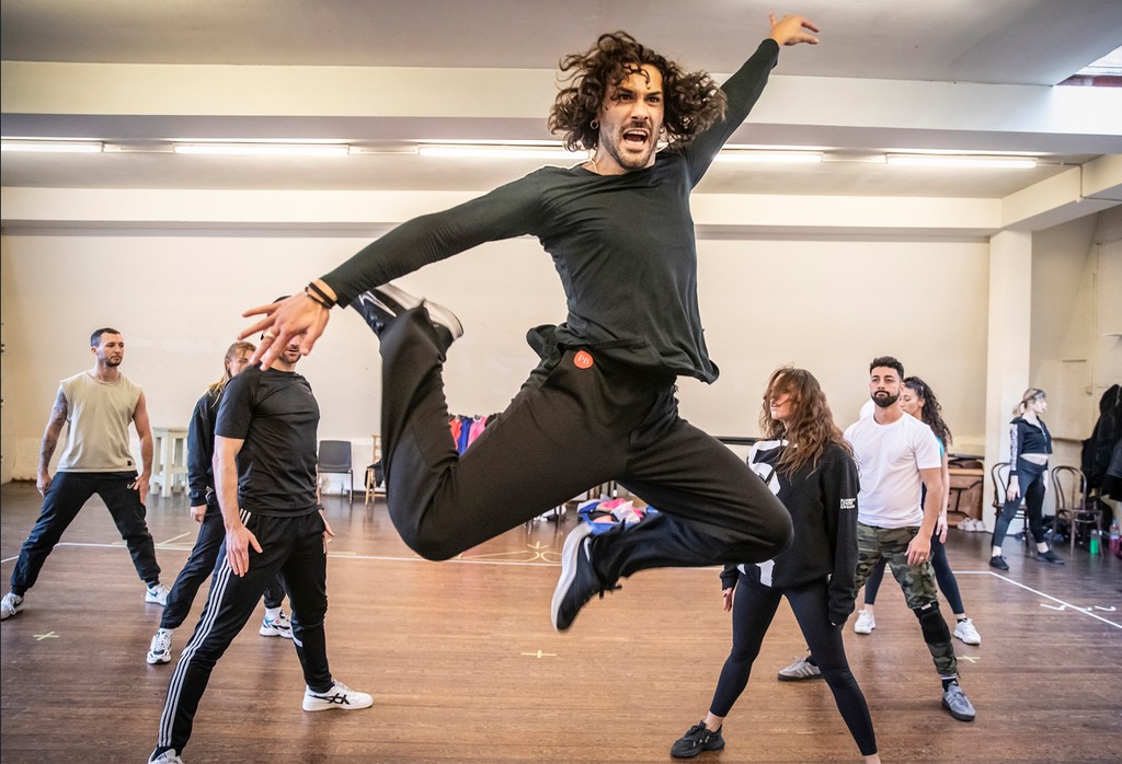 Graziano in mid air and his dancers in rehearsals