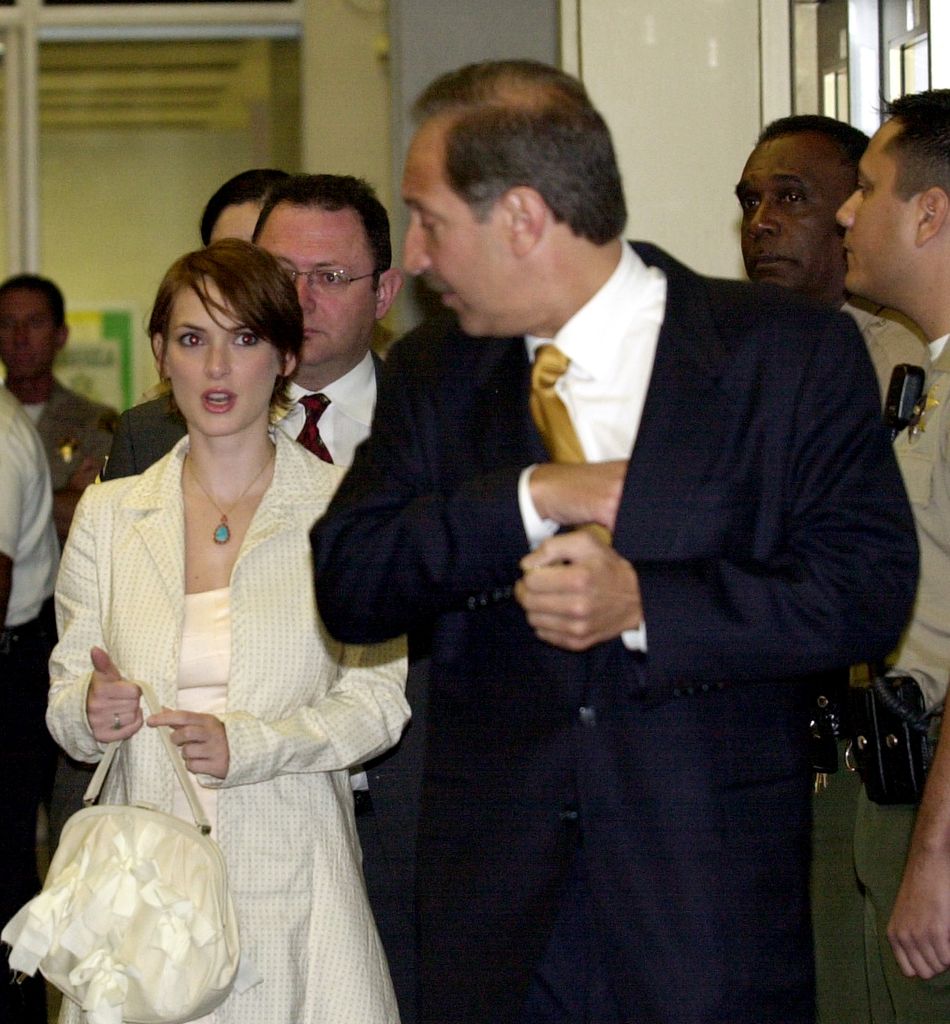 Winona Ryder & her attorney Mark Geragos arrive at Beverly Hills Superior Court for a court hearing on her shoplifting trial. The judge went along with a prosecution motion to dismiss the charge that Ryder illegally possessed painkillers when she was arrested for alleged shoplifting last December. 