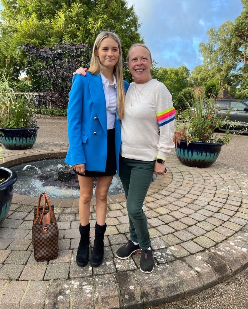 Jayne with her daughter in their front garden