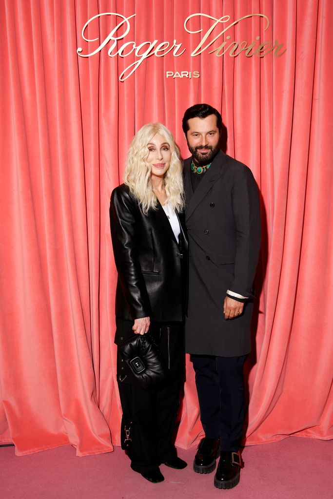 Cher in leather blazer and Gherardo Felloni at Paris Fashion Week 