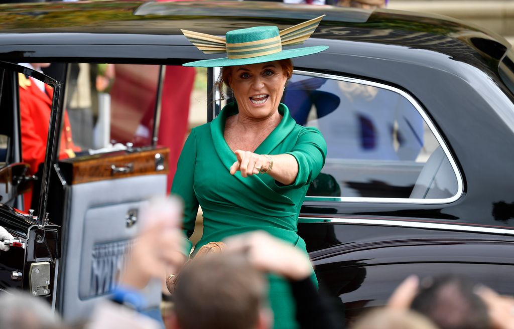 Sarah Ferguson in a green dress pointing at the crowd