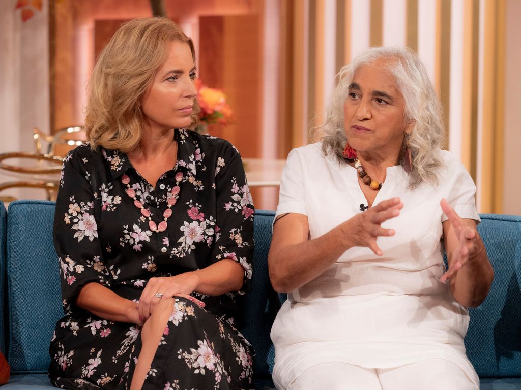 mother and daughter chatting on sofa