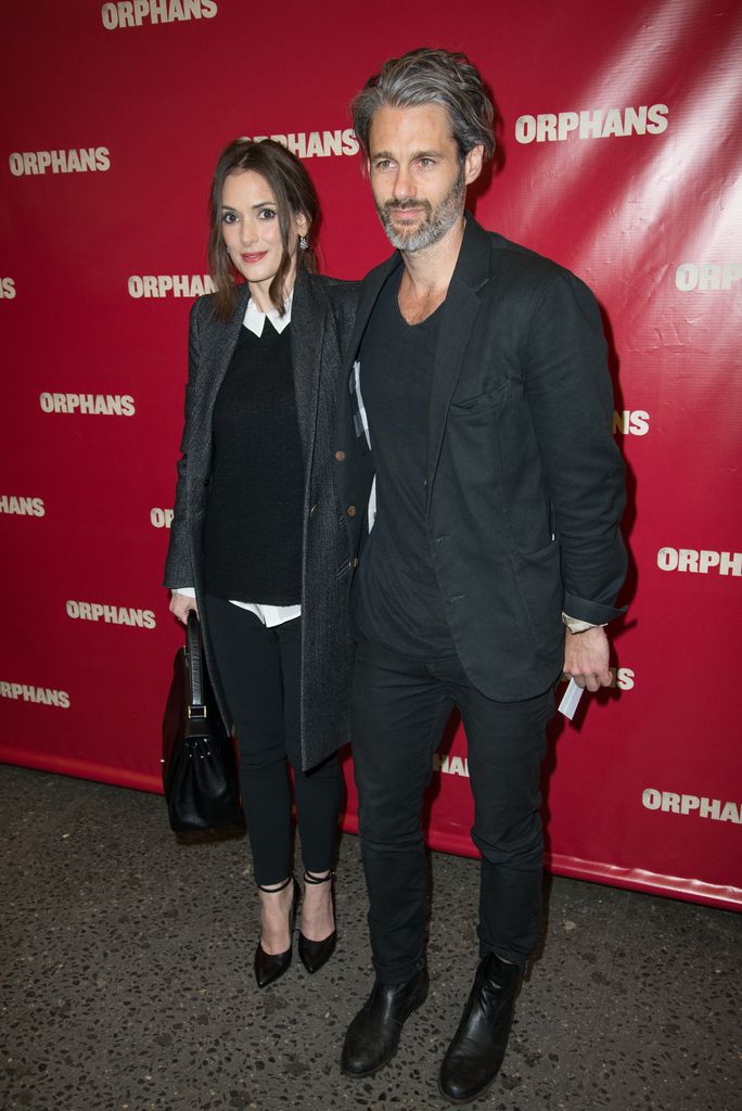 Winona Ryder and Scott Mackinlay Hahn attend the "Orphans" Broadway opening night at the Gerald Schoenfeld Theatre on April 18, 2013 in New York City.