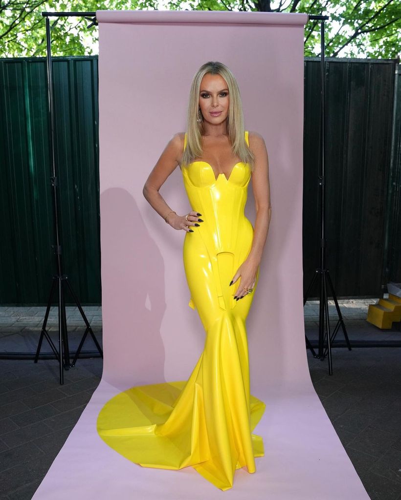 Amanda Holden wearing a yellow latex dress