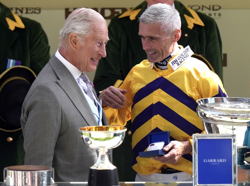 King Charles III with Paul Mulrennan, following the King Charles III Stakes, which was won by American Affair