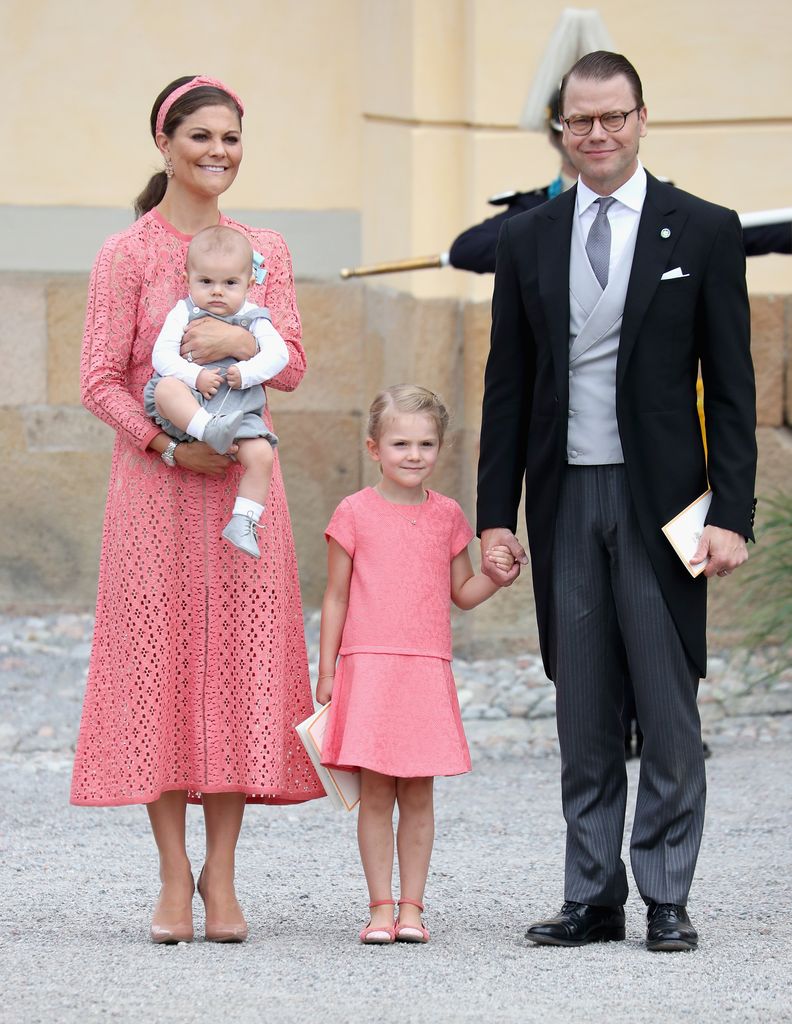 Crown Princess Victoria in coral with Prince Daniel of Sweden, with their children Prince Oscar and Princess Estelle of Sweden