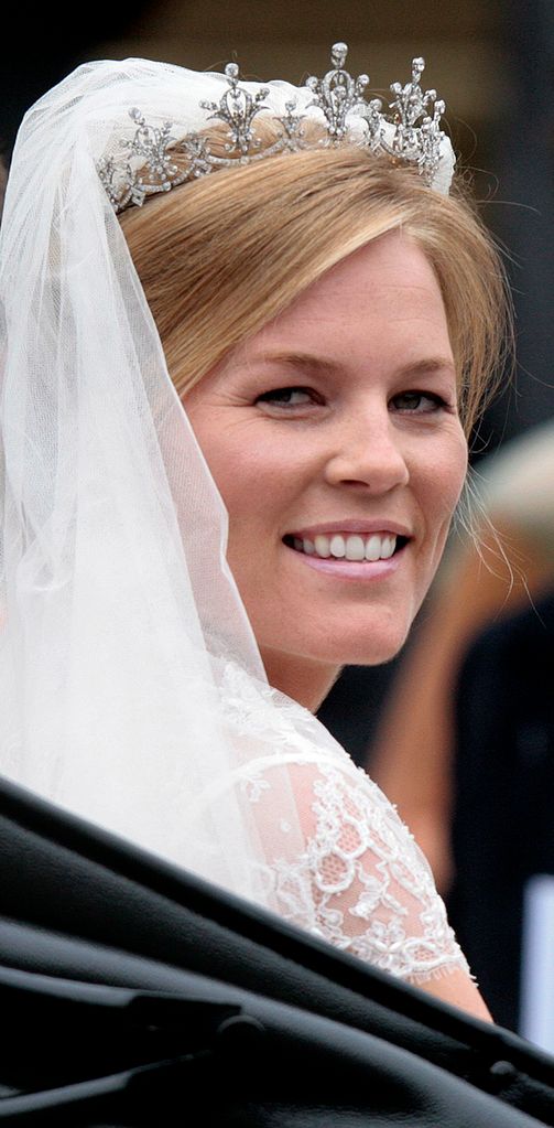 Autumn Kelly leaves in an open carriage following her marriage to Peter Phillips