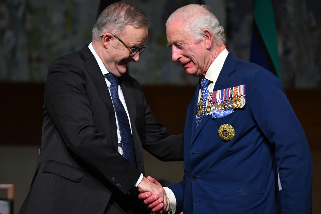 King Charles shakes hands with Australian Prime Minister Anthony Albanese after attending a reception at Parliament House 