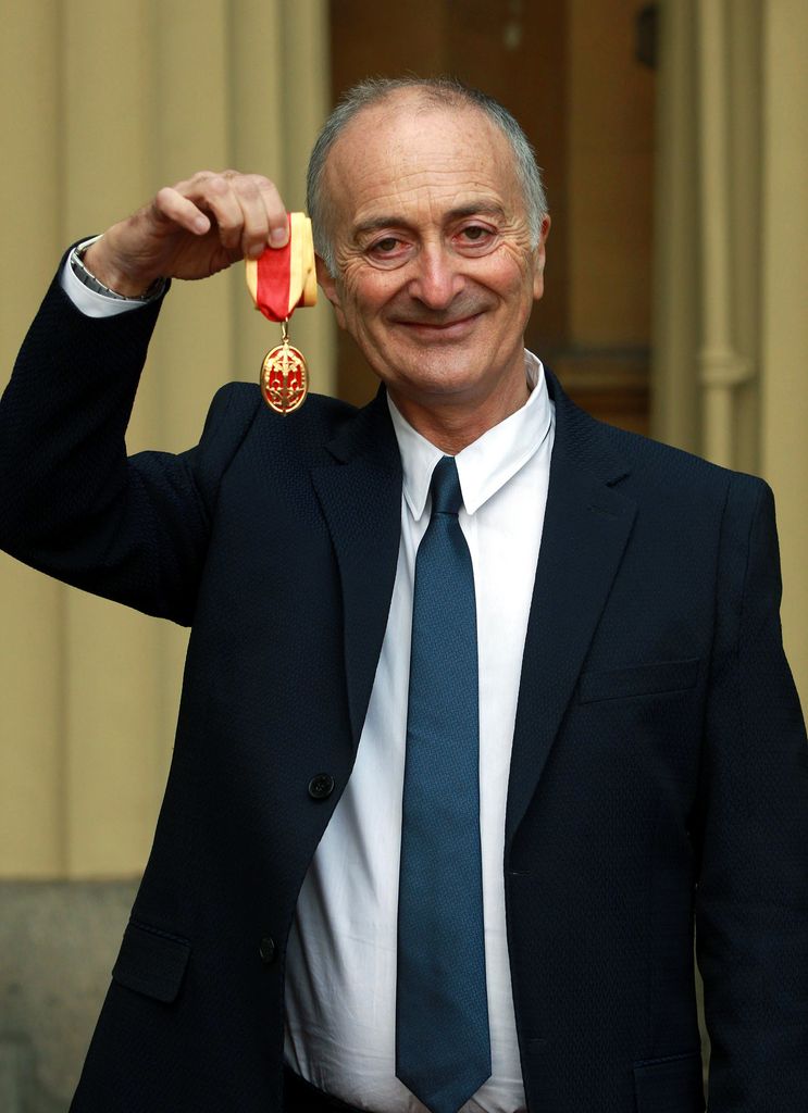 man holding medal