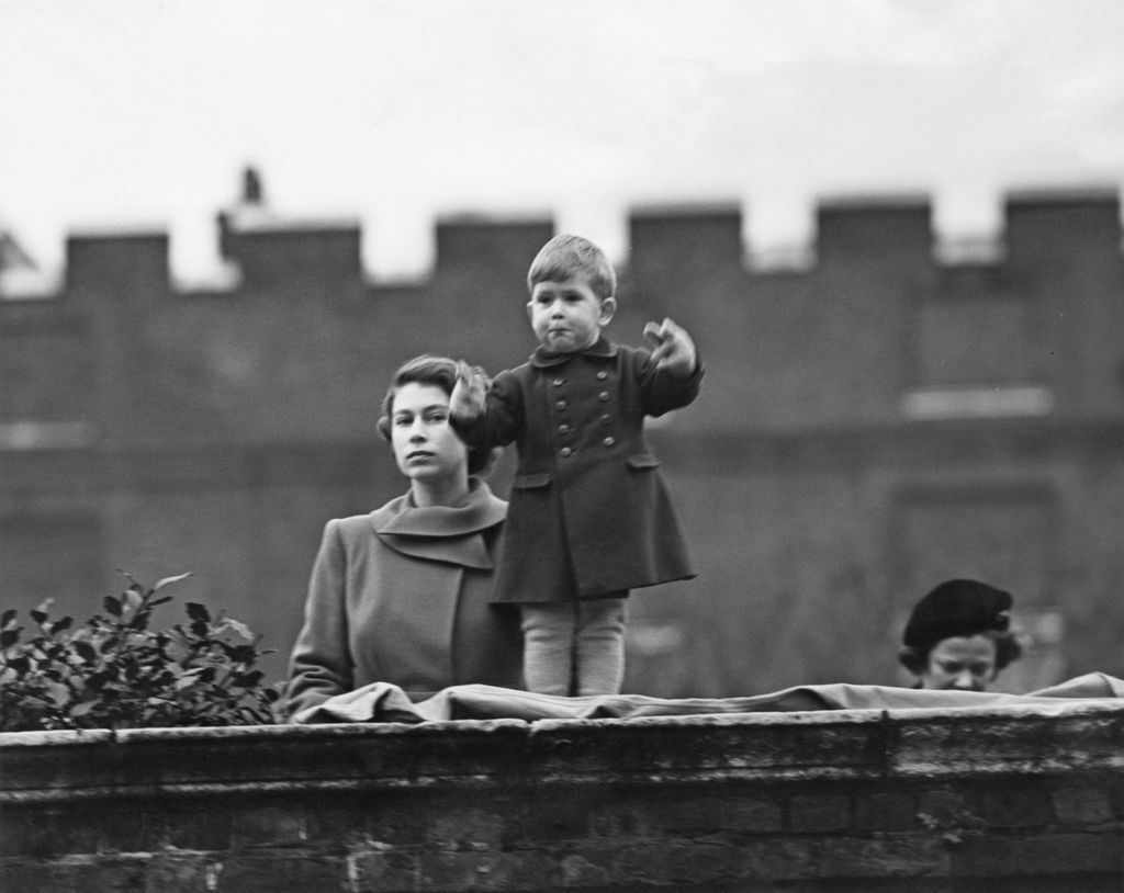 mother and son watching procession