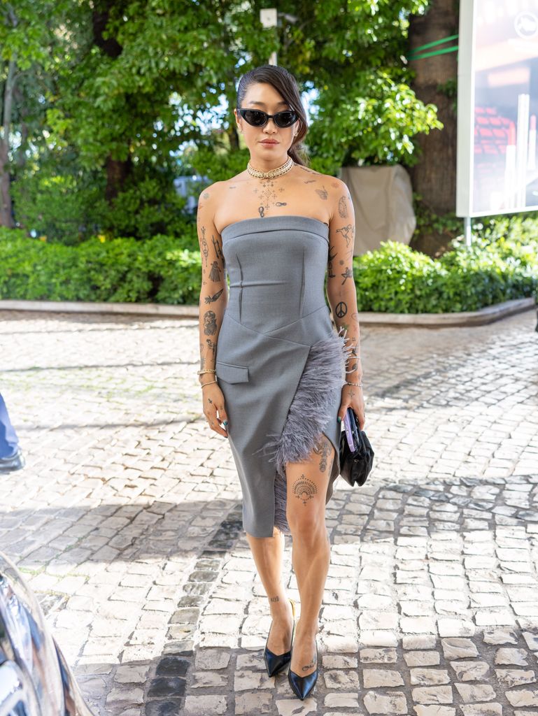Peggy Gou is seen in a grey dress during the 77th Cannes Film Festival 