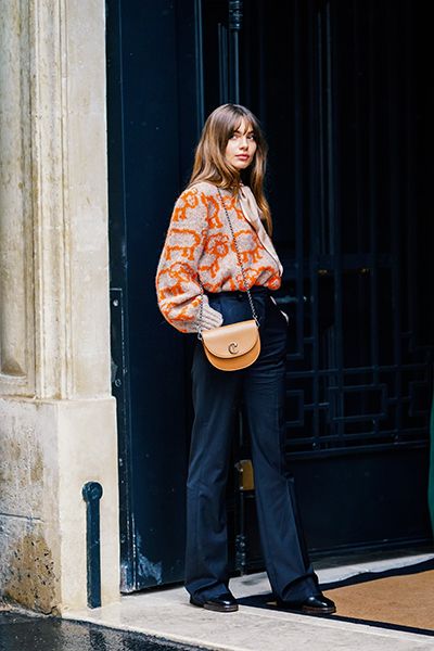 Woman Wearing Flares And A Statement Knit