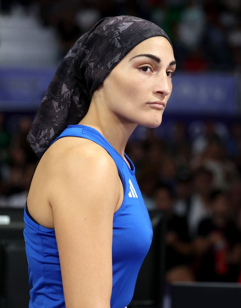 Angela Carini heading into a boxing ring