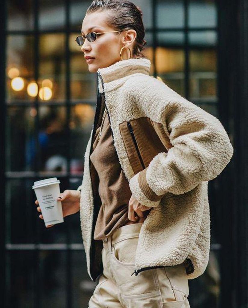 Bella Hadid wears a cosy fleece jacket as part of a tonal outfit