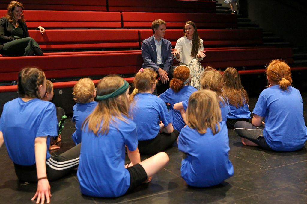 The Duke of Westminster and Olivia Henson speaking to a group of children