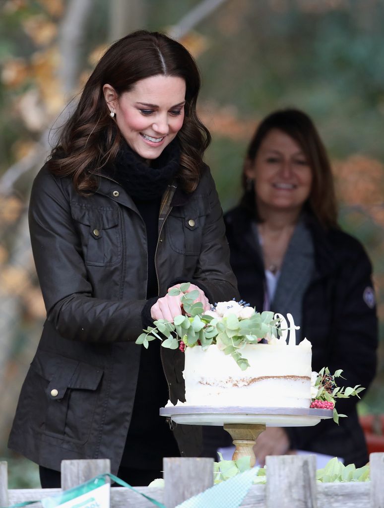 Kate cutting a cake