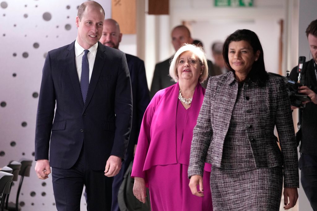 Prince William is guided by chair Liz Padmore and Beatrice Butsana-Sita, British Red Cross CEO, as he visits the British Red Cross HQ 