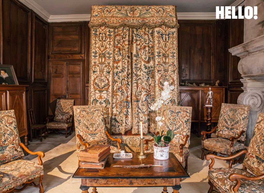 King Louis XIII's four-poster bed and armchairs inside Château de Pennautier
