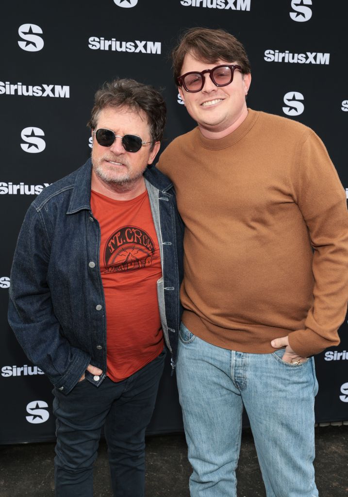michael j fox and son sam both wearing denim at metallica event