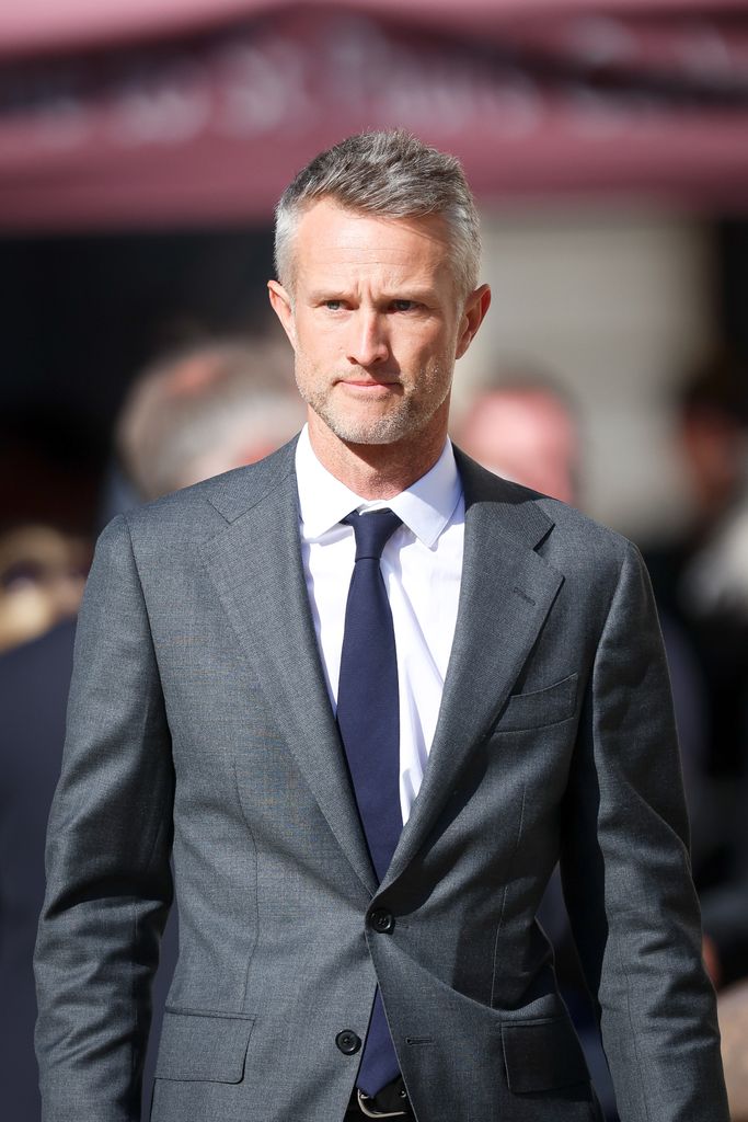 man in grey suit attending service at st pauls 