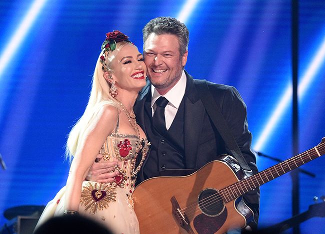 Gwen and Blake embrace on stage