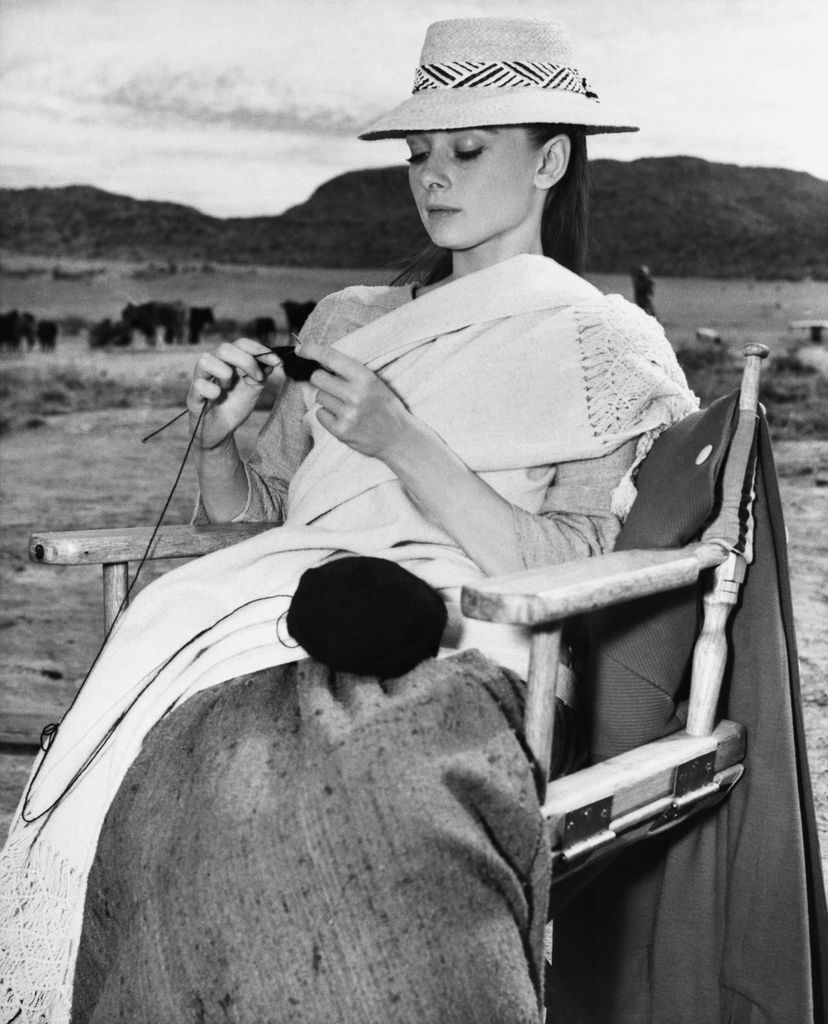 (Original Caption) 4/18/1959-Durango, Mexico: Tending to her knitting, Audrey Hepburn gets started on a black cashmere sweater on location at Durango, Mexico. She's filming United Artists' "The Unforgiven" there, and knits to relax between scenes, concent