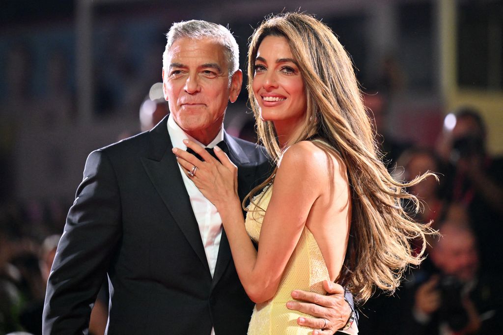 George Clooney and his wife Amal Clooney attend the red carpet of the movie "Wolfs" presented out of competition during the 81st International Venice Film Festival at Venice Lido, on September 1, 2024