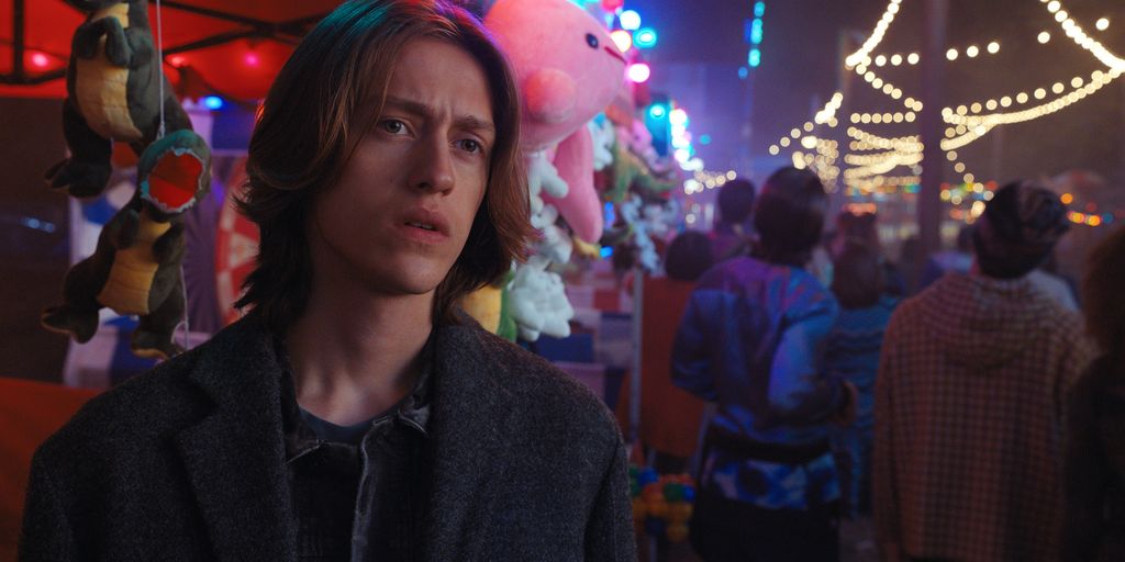 close-up of young man at funfair