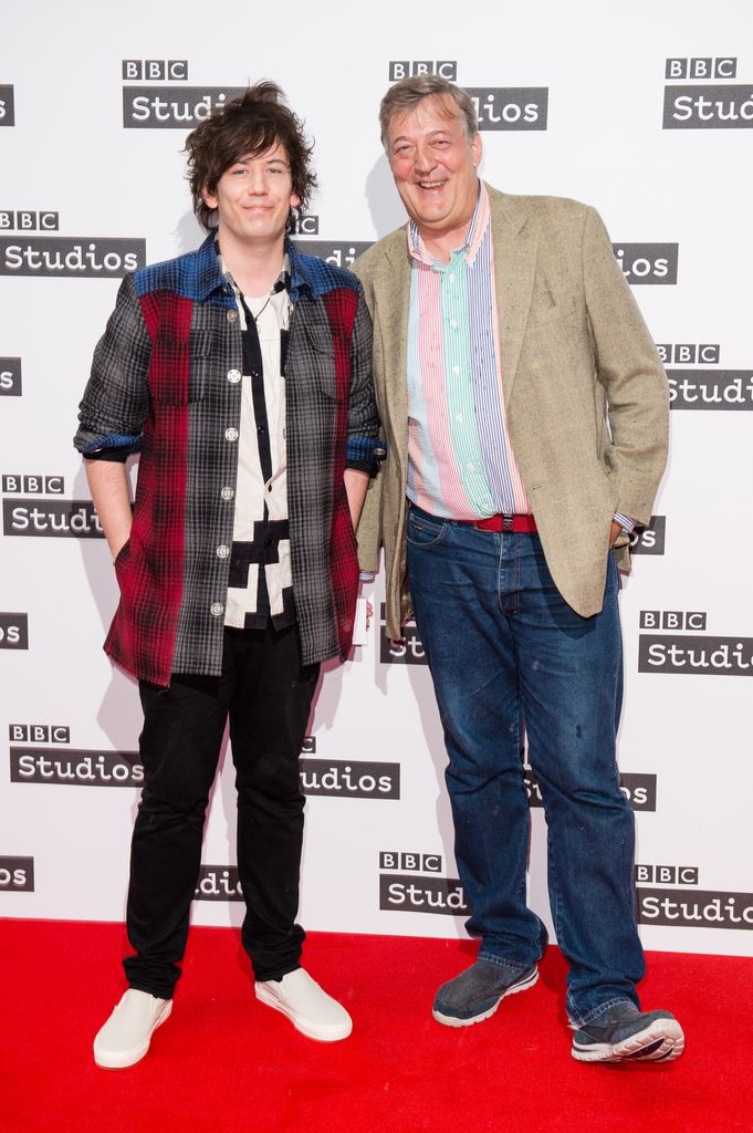 couple posing on red carpet