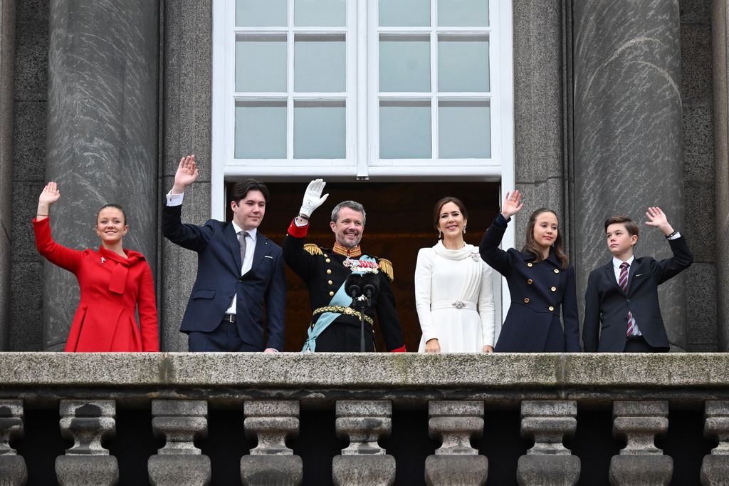 Princess Isabella, Crown Prince Christian, King Frederik X of Denmark, Queen Mary of Denmark, Princess Josephine and Prince Vincent wave after the proclamation