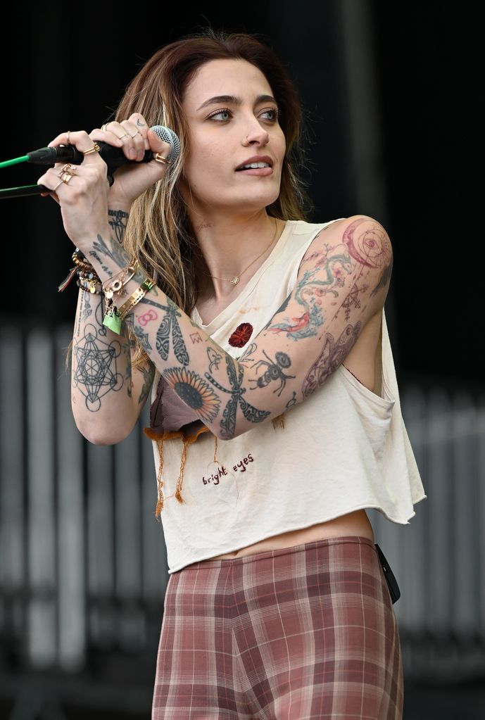 Paris Jackson singing into a mic on stage