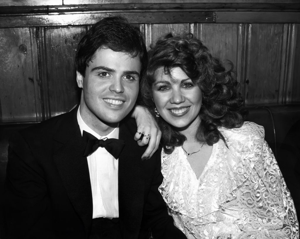 Donny Osmond smiling with wife Debbie Osmond 