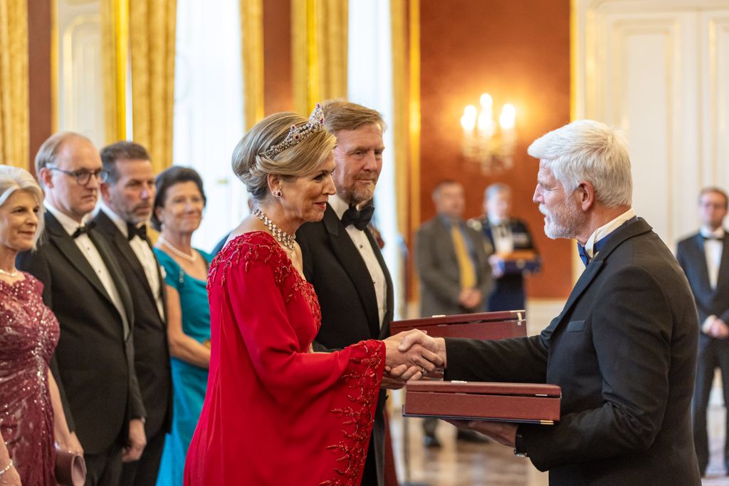 Dutch King Willem-Alexander (C) and Queen Maxima (L) receive the Order of the White Lion from Czech President Petr Pavel 