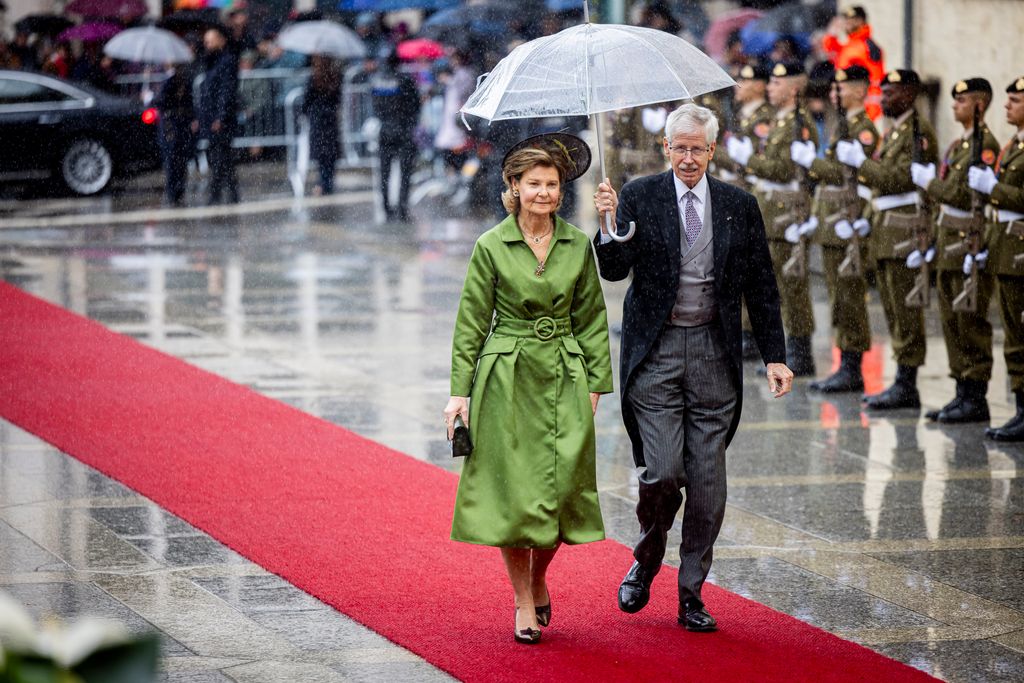 Princess Margaretha of Liechtenstein and Prince Nikolaus of Liechtenstein walking under umbrella