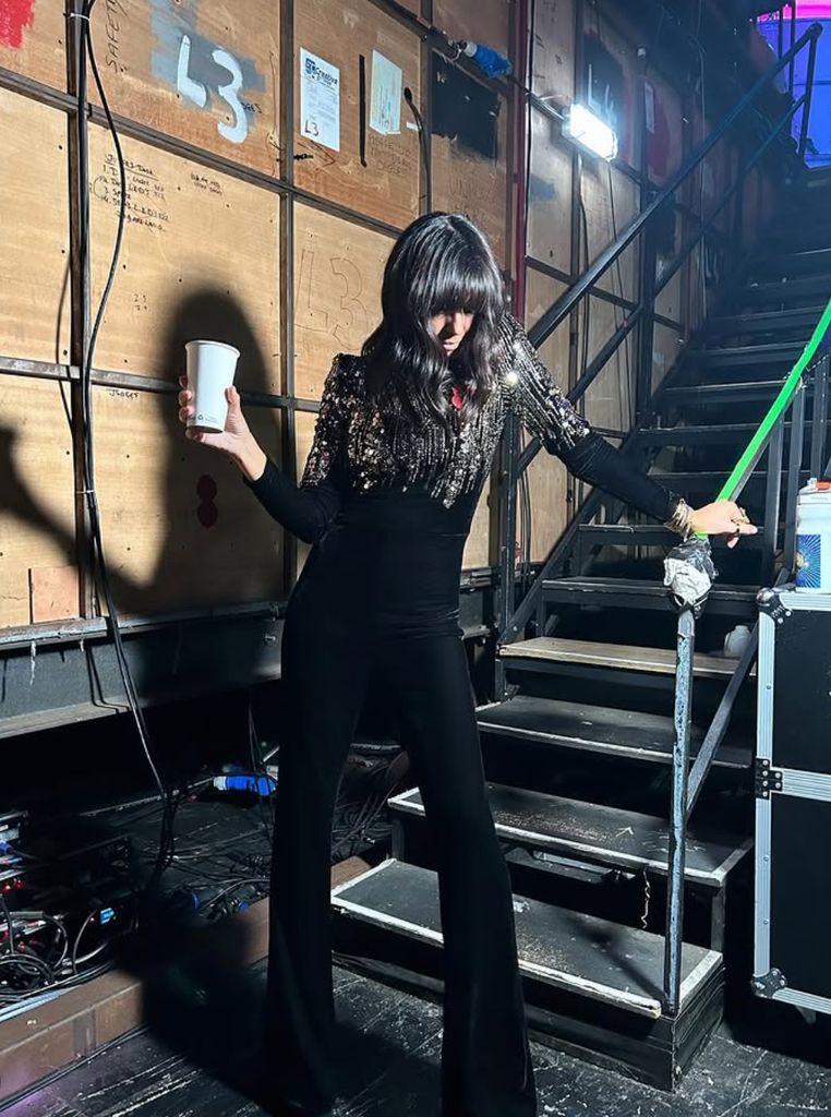 Claudia Winkleman's black and gold velvet jumpsuit on Strictly Come Dancing