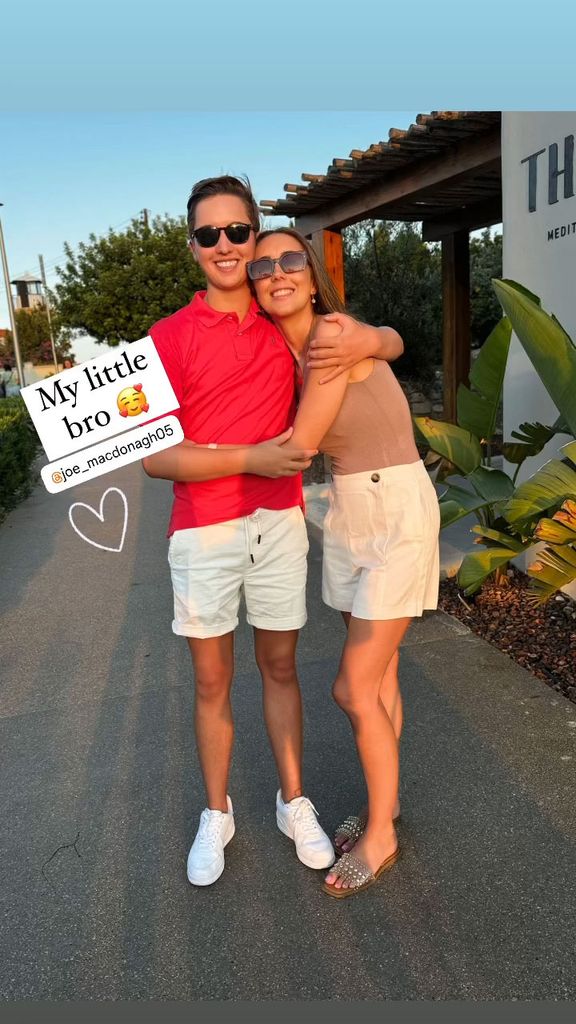 brother and sister posing for photo