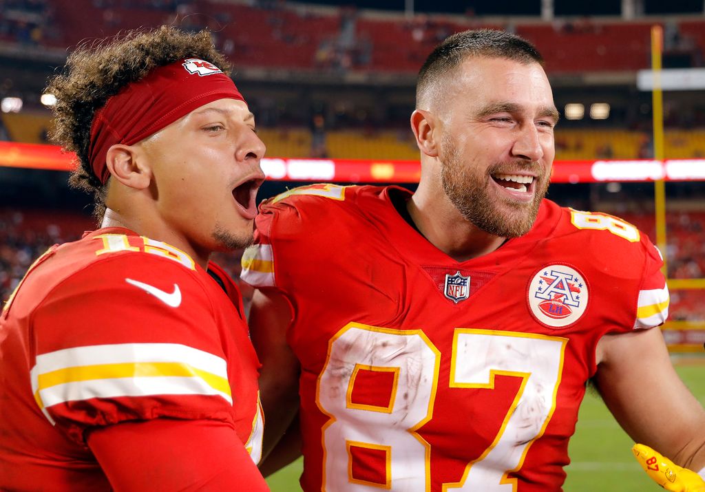 Patrick Mahomes #15 and Travis Kelce #87 of the Kansas City Chiefs celebrate after the Chiefs defeated the Las Vegas Raiders to win the game at Arrowhead Stadium on October 10, 2022 in Kansas City, Missouri