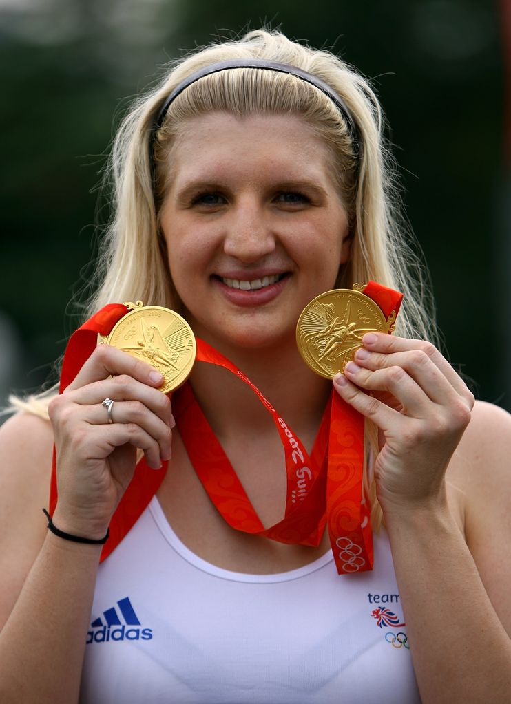 Rebecca Adlington of Great Britain holds up her two Olympic swimming gold medals outside the Athletes Village during Day 8 of the Beijing 2008 Olympic Games on August 16, 2008 in Beijing, China