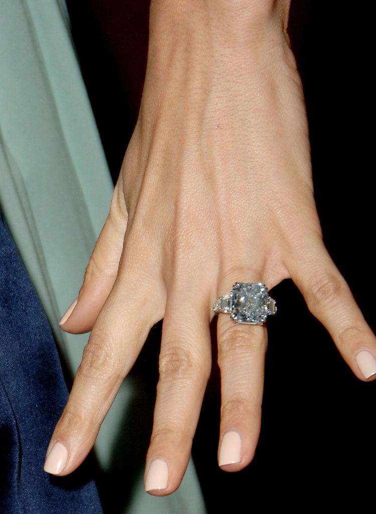 JLo's hand with diamond ring 