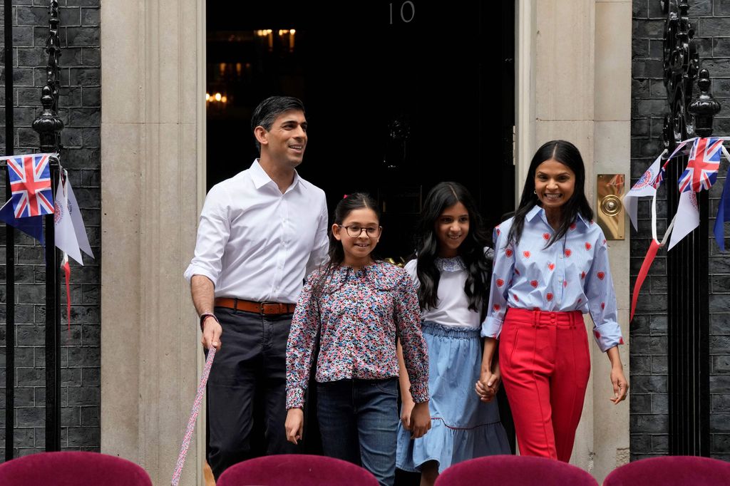 Britain's Prime Minister Rishi Sunak, his wife Akshata Murty, and their daughters Krishna Sunak and Anoushka Sunak prepare to welcome guests for a Coronation Big Lunch organised in Downing Street, in London, on May 7, 2023