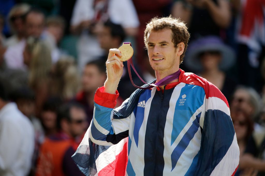 Andy Murray holds up gold medal