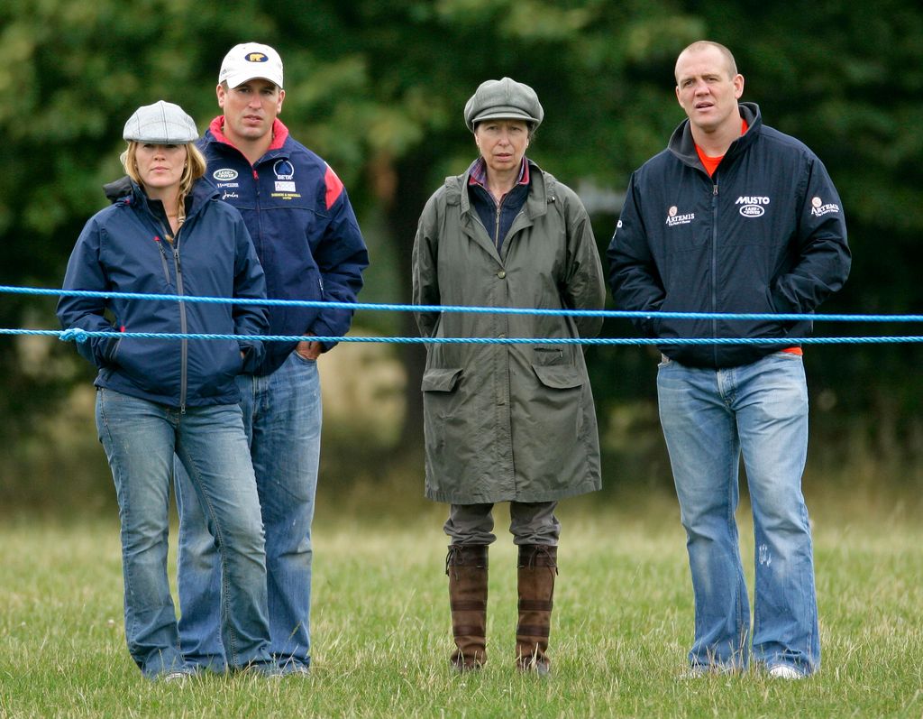 zara and mike tindall with princess anne and peter phillips in a field