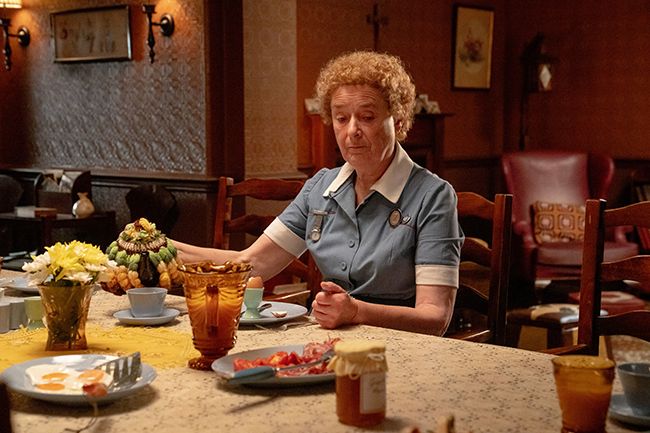 Nurse Crane sits at table in Call the Midwife