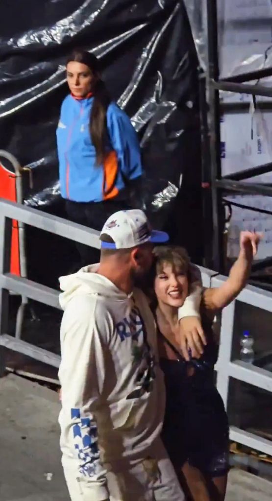 Travis surprises Taylor with a sweet kiss