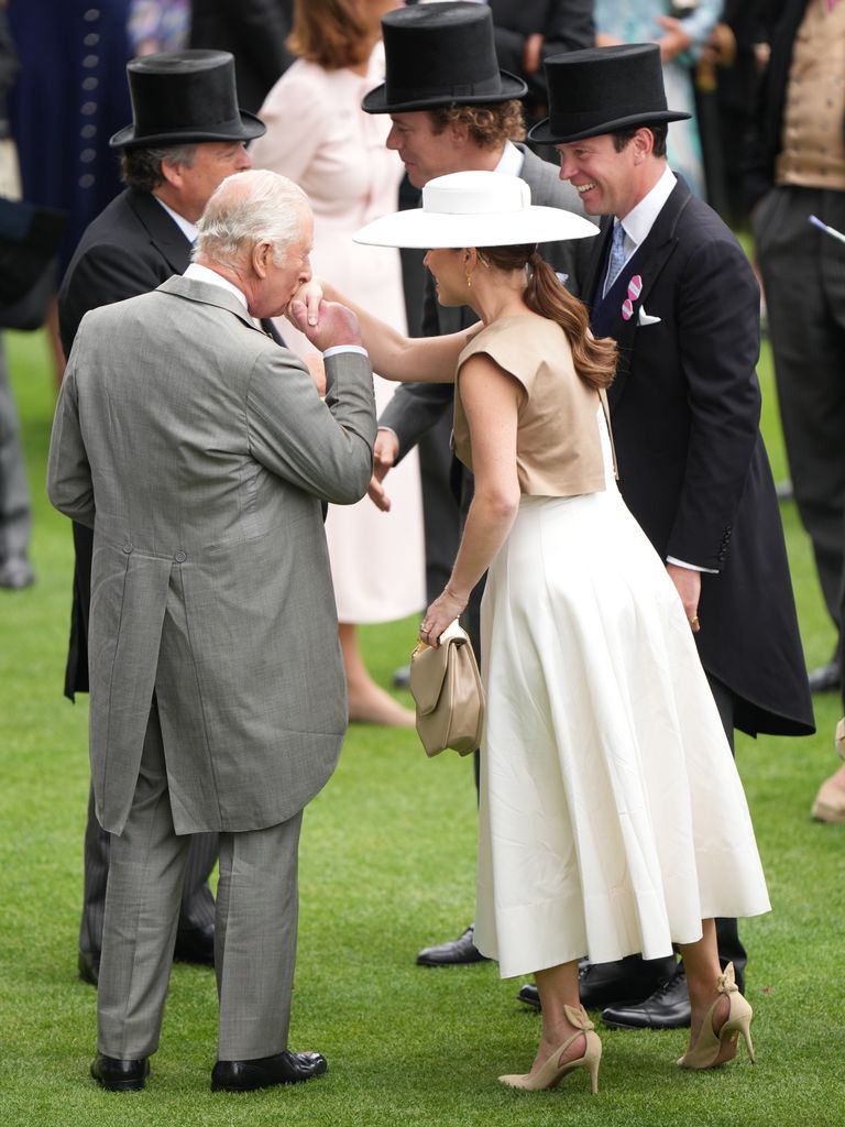 King Charles kissing niece Princess Eugenie