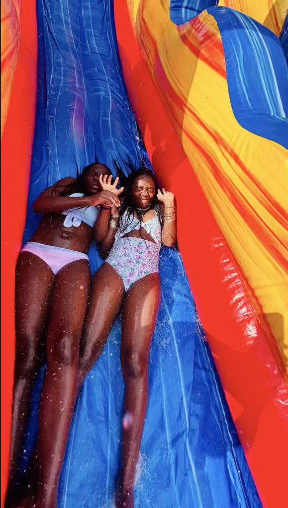 Madonna's daughters Stella and Estere slide down a water slide at her 12th birthday party, shared on Instagram