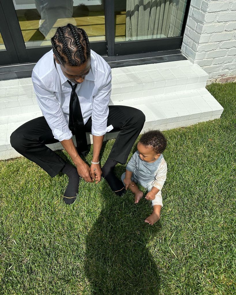 asap with son sitting on grass