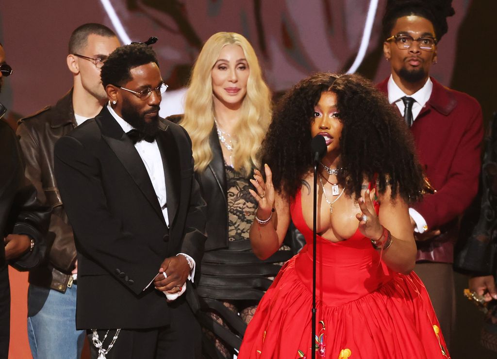 Cher (C) presents the Record Of The Year award for "luther" to (from L) Kendrick Lamar, SZA, and Scott Bridgeway onstage during the 68th GRAMMY Awards at Crypto.com Arena on February 01, 2026 in Los Angeles, California.