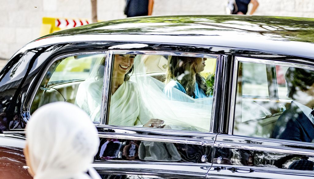 Rajwa Al-Saif arriving at her wedding ceremony in a Rolls Royce